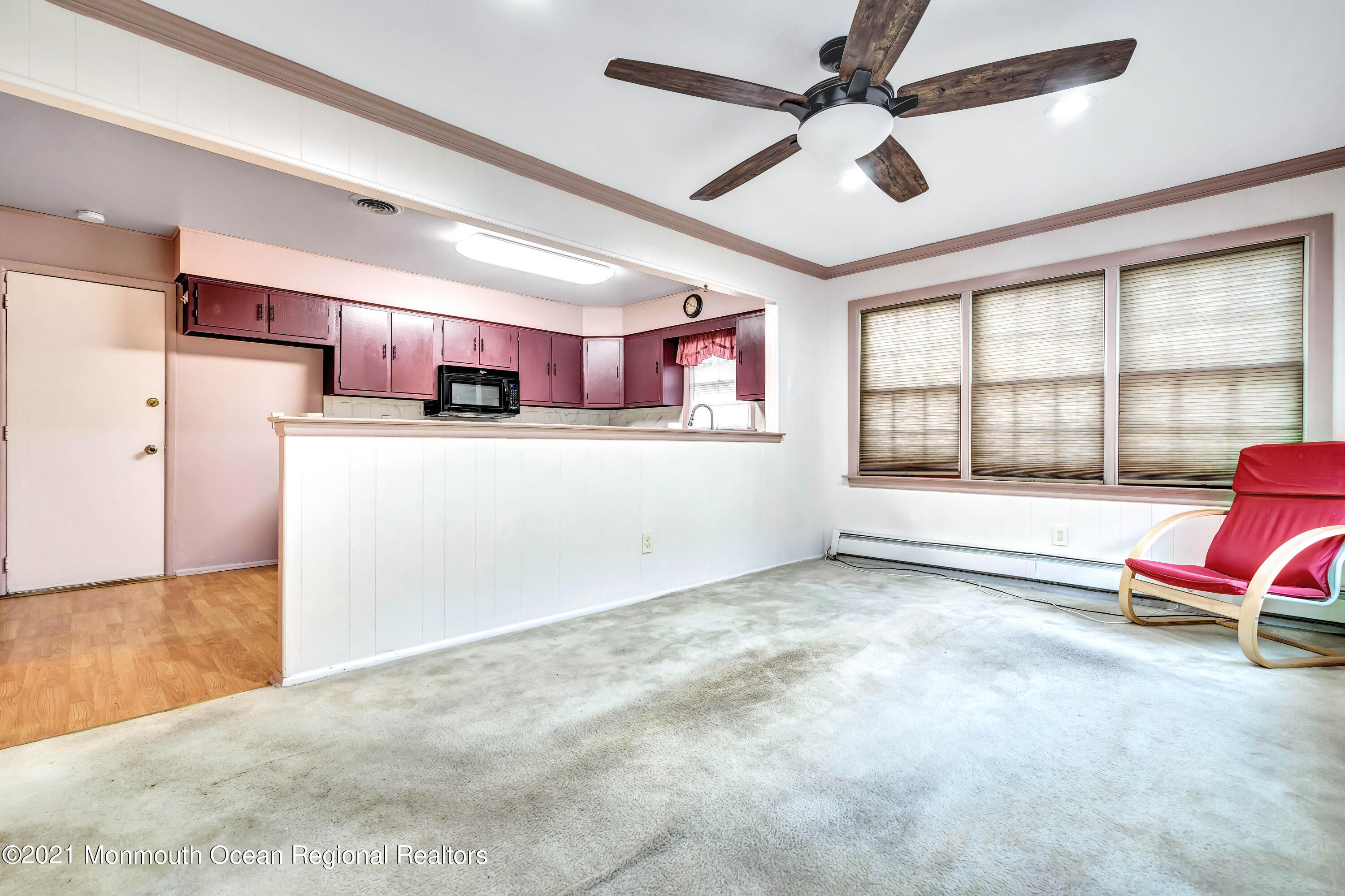 105 Georgetown Road Toms River, NJ 08757 - Photo 22 of 35 a living room with furniture a flat screen tv and a large window