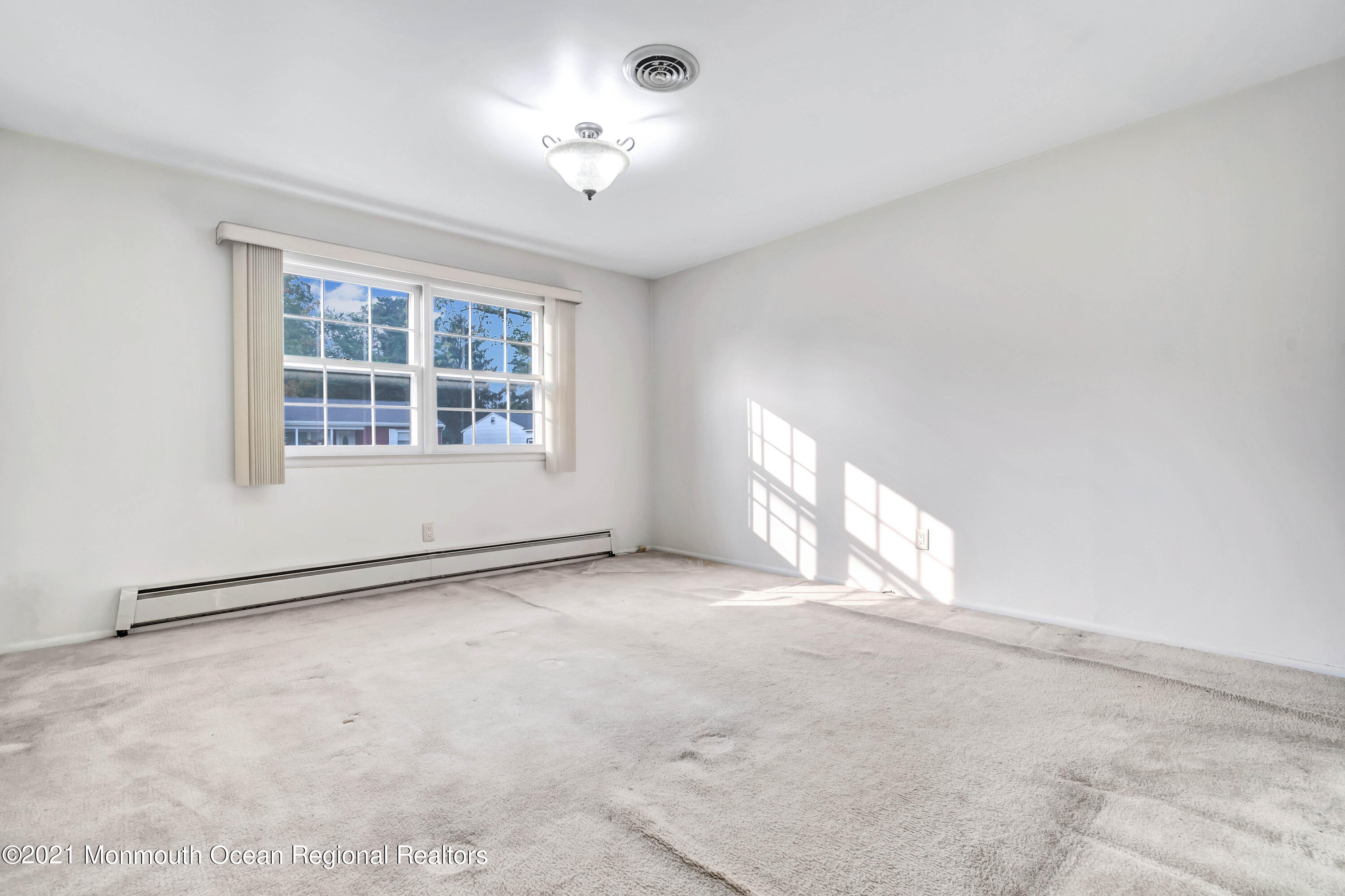 105 Georgetown Road Toms River, NJ 08757 - Photo 27 of 35 an empty room with a empty space and windows
