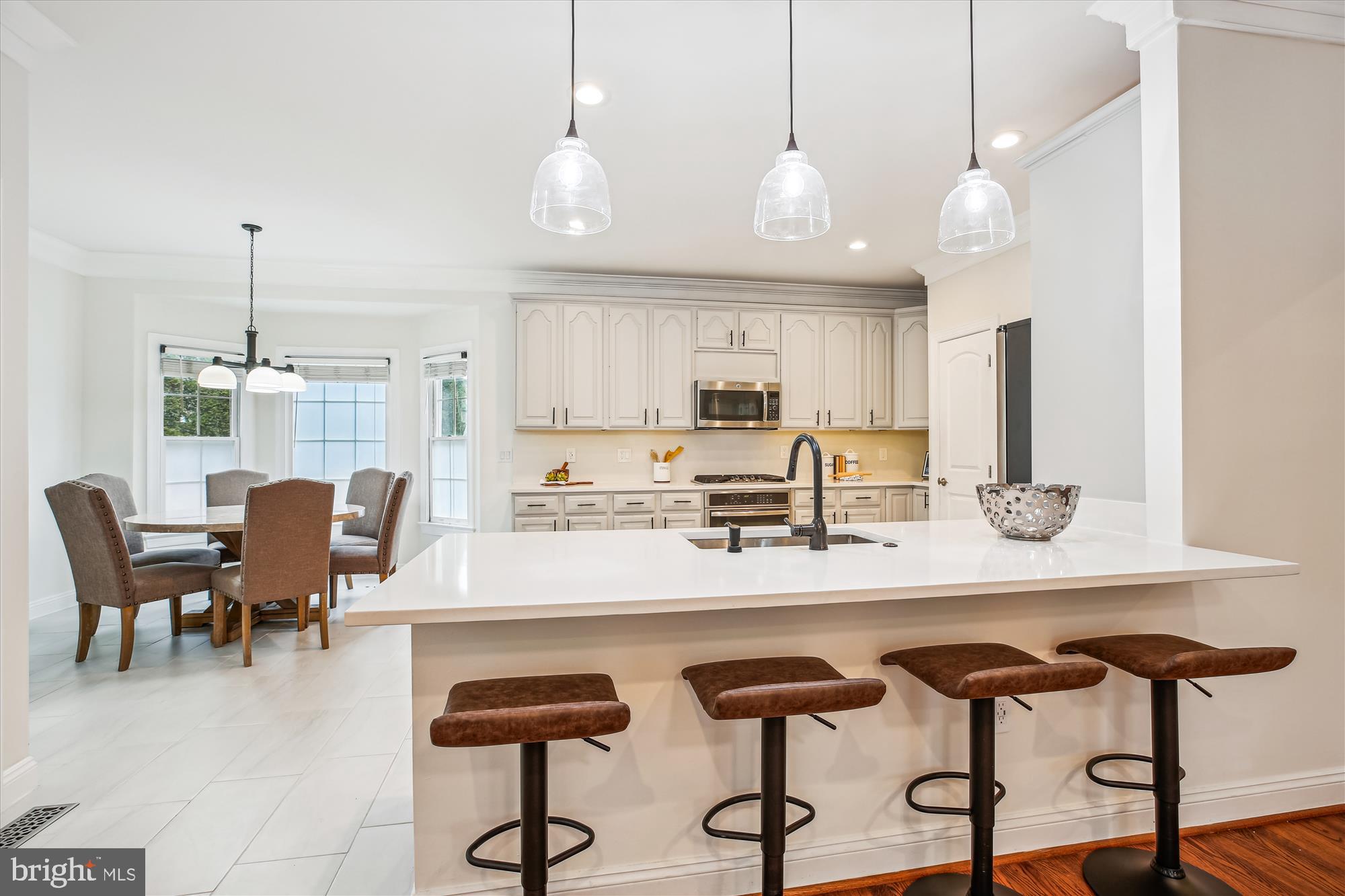 302 Tschiffely Square Road Gaithersburg, MD 20878 - Photo 12 of 77 a view of kitchen with granite countertop cabinets table and chairs