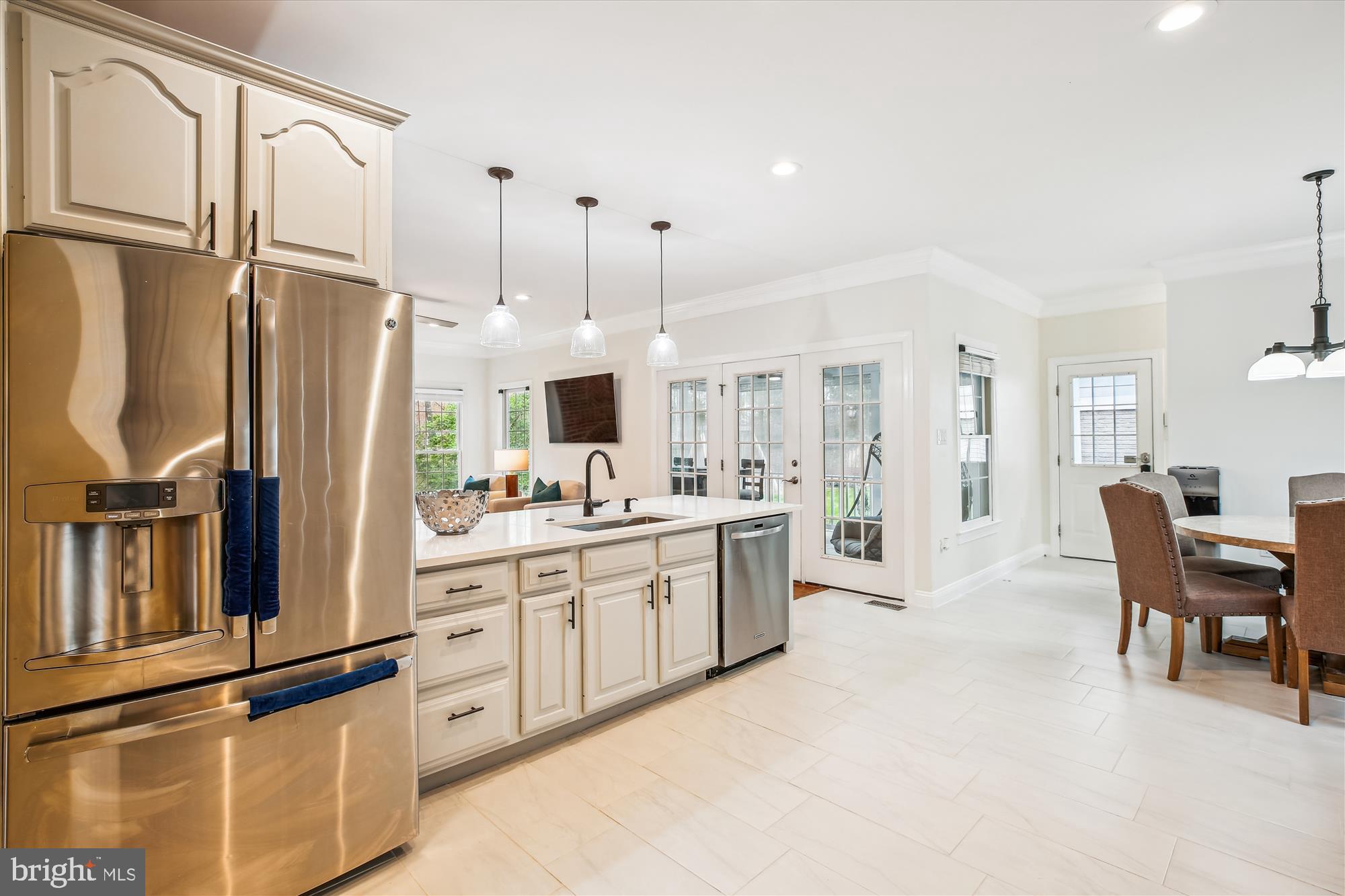 302 Tschiffely Square Road Gaithersburg, MD 20878 - Photo 15 of 77 a kitchen with stainless steel appliances kitchen island granite countertop a refrigerator and cabinets