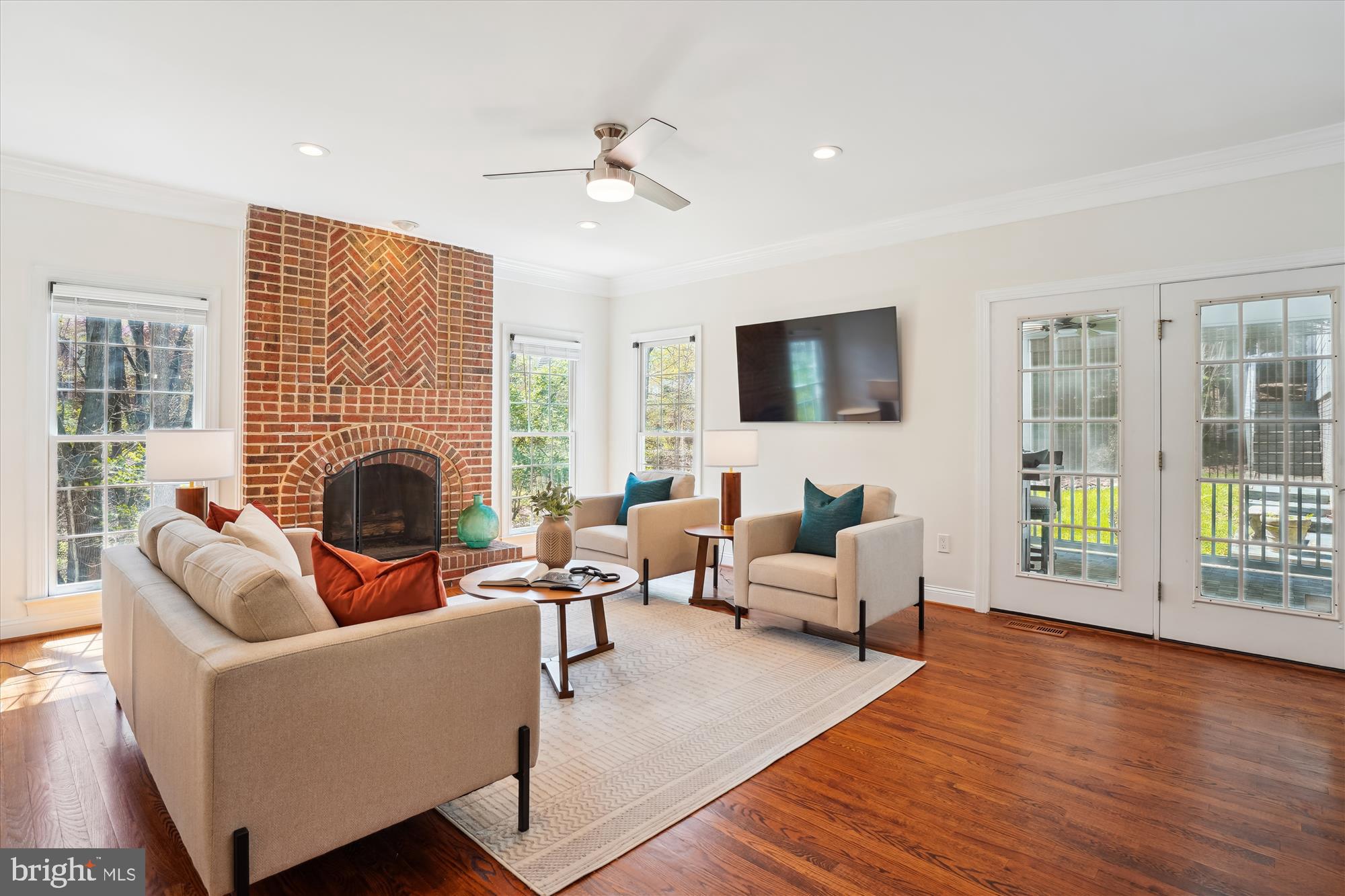 302 Tschiffely Square Road Gaithersburg, MD 20878 - Photo 20 of 77 a living room with furniture a fireplace and a flat screen tv