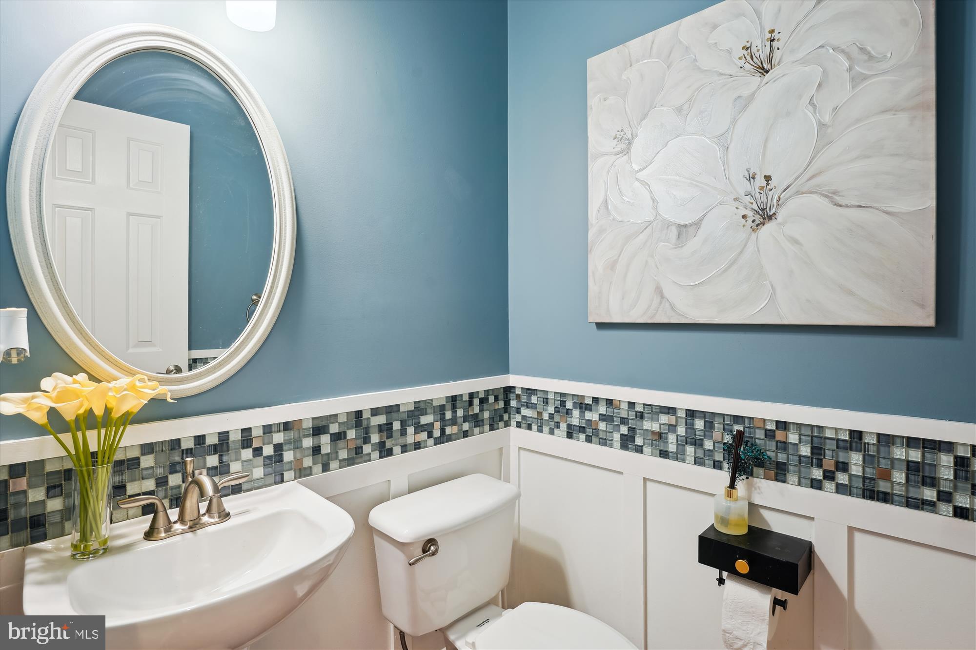 302 Tschiffely Square Road Gaithersburg, MD 20878 - Photo 28 of 77 a bathroom with a toilet a sink and mirror