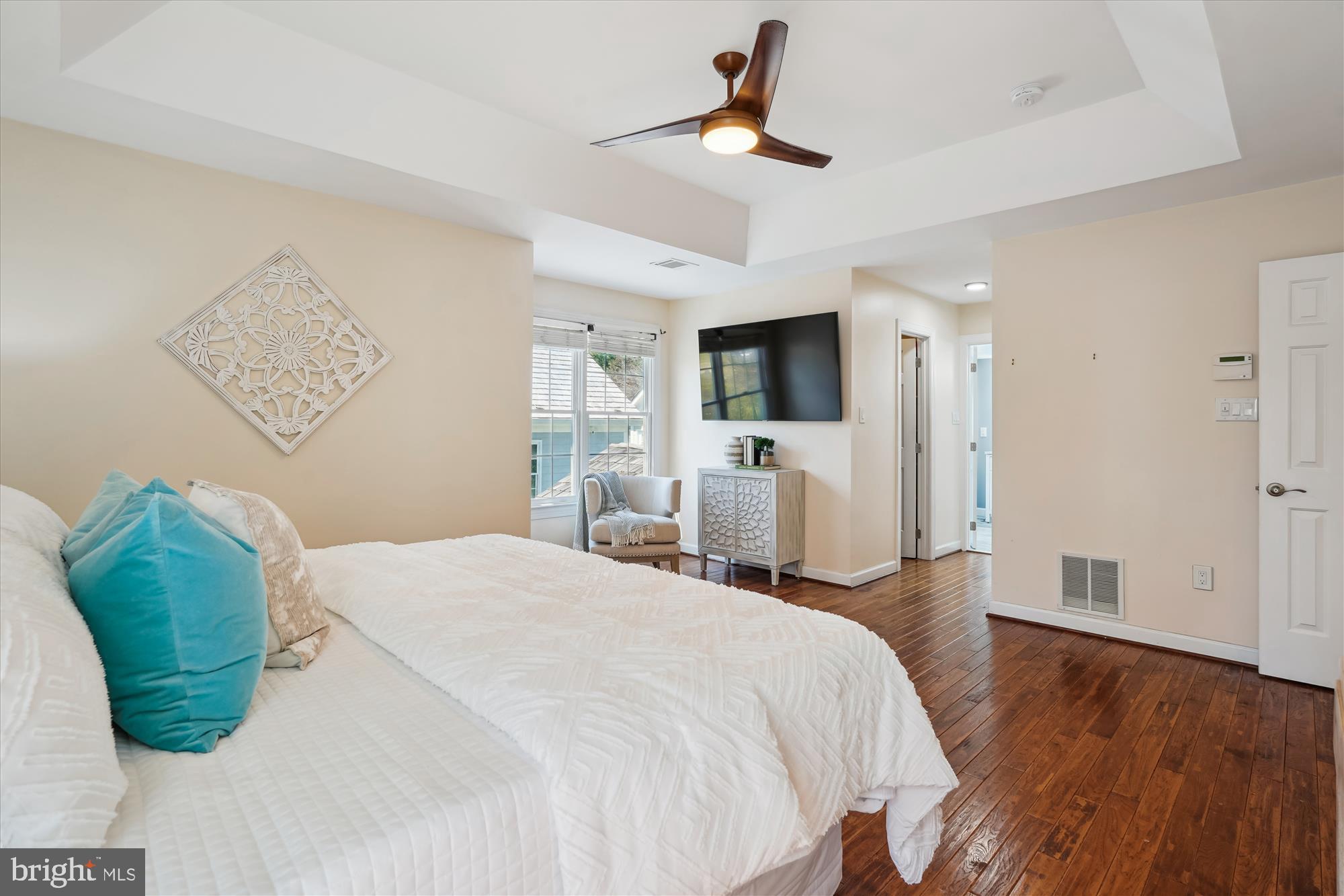 302 Tschiffely Square Road Gaithersburg, MD 20878 - Photo 32 of 77 a bedroom with a bed chandelier and a window