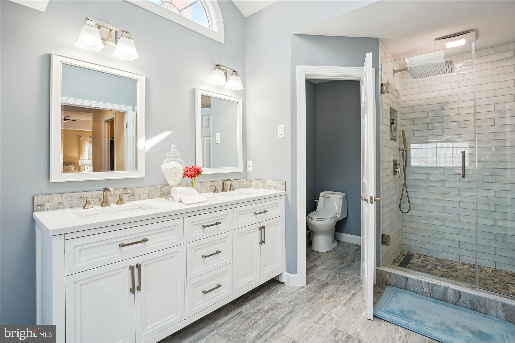 302 Tschiffely Square Road Gaithersburg, MD 20878 - Photo 34 of 77 a bathroom with a double vanity sink toilet and shower