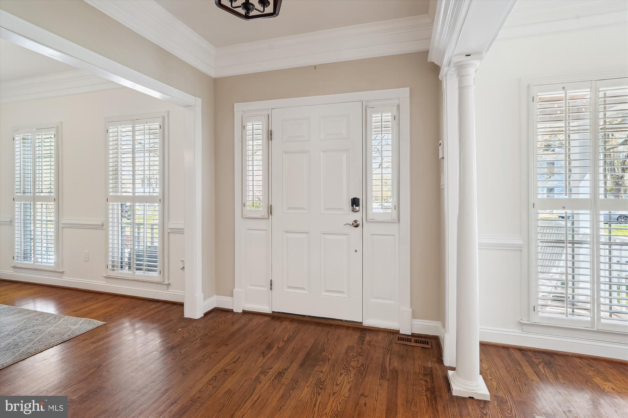 302 Tschiffely Square Road Gaithersburg, MD 20878 - Photo 4 of 77 an empty room with wooden floor and windows