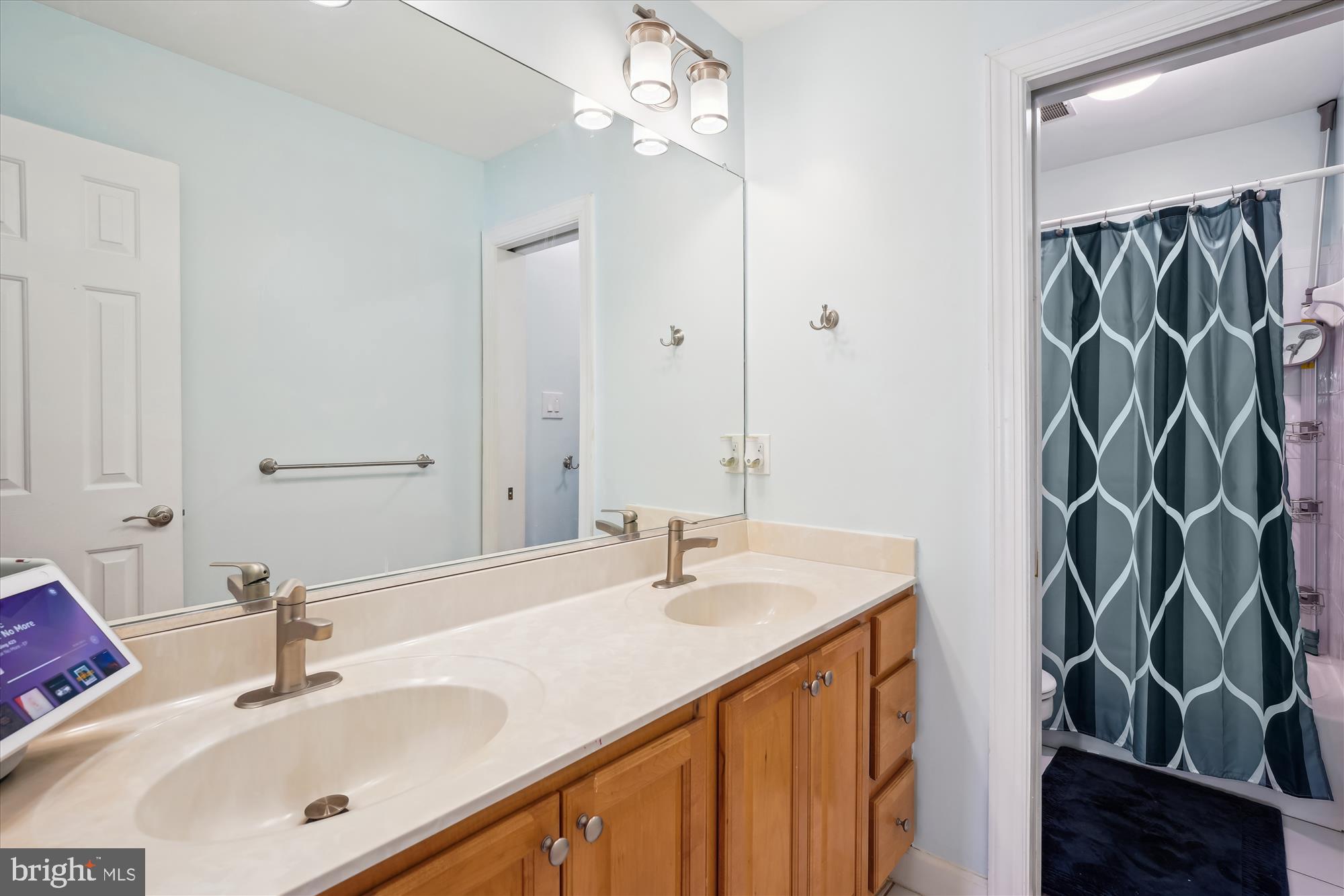 302 Tschiffely Square Road Gaithersburg, MD 20878 - Photo 45 of 77 a bathroom with a sink and a mirror