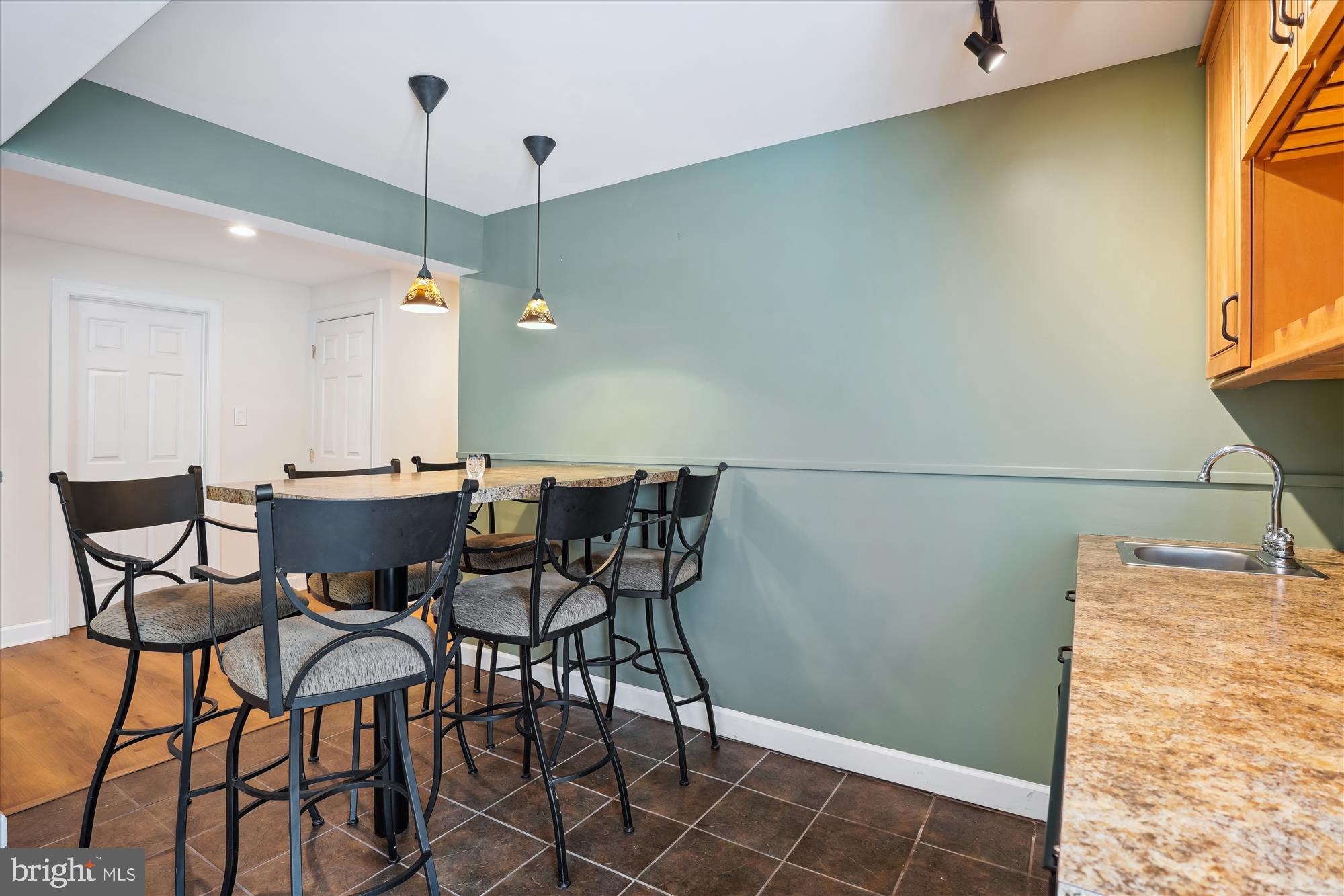 302 Tschiffely Square Road Gaithersburg, MD 20878 - Photo 51 of 77 a view of a dining room with furniture and a chandelier