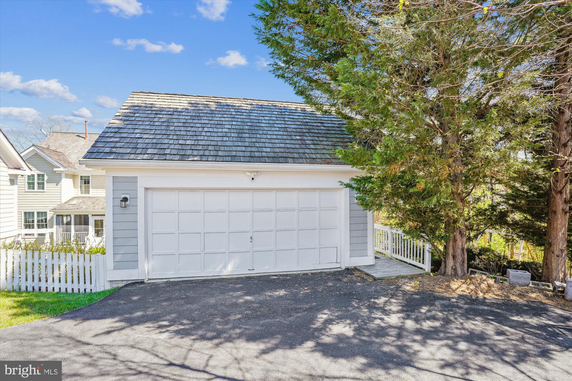 302 Tschiffely Square Road Gaithersburg, MD 20878 - Photo 60 of 77 a front view of a house with a garden