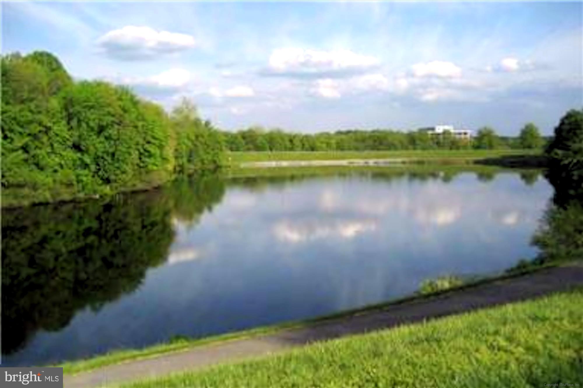 302 Tschiffely Square Road Gaithersburg, MD 20878 - Photo 70 of 77 a view of a lake in front of house with a yard