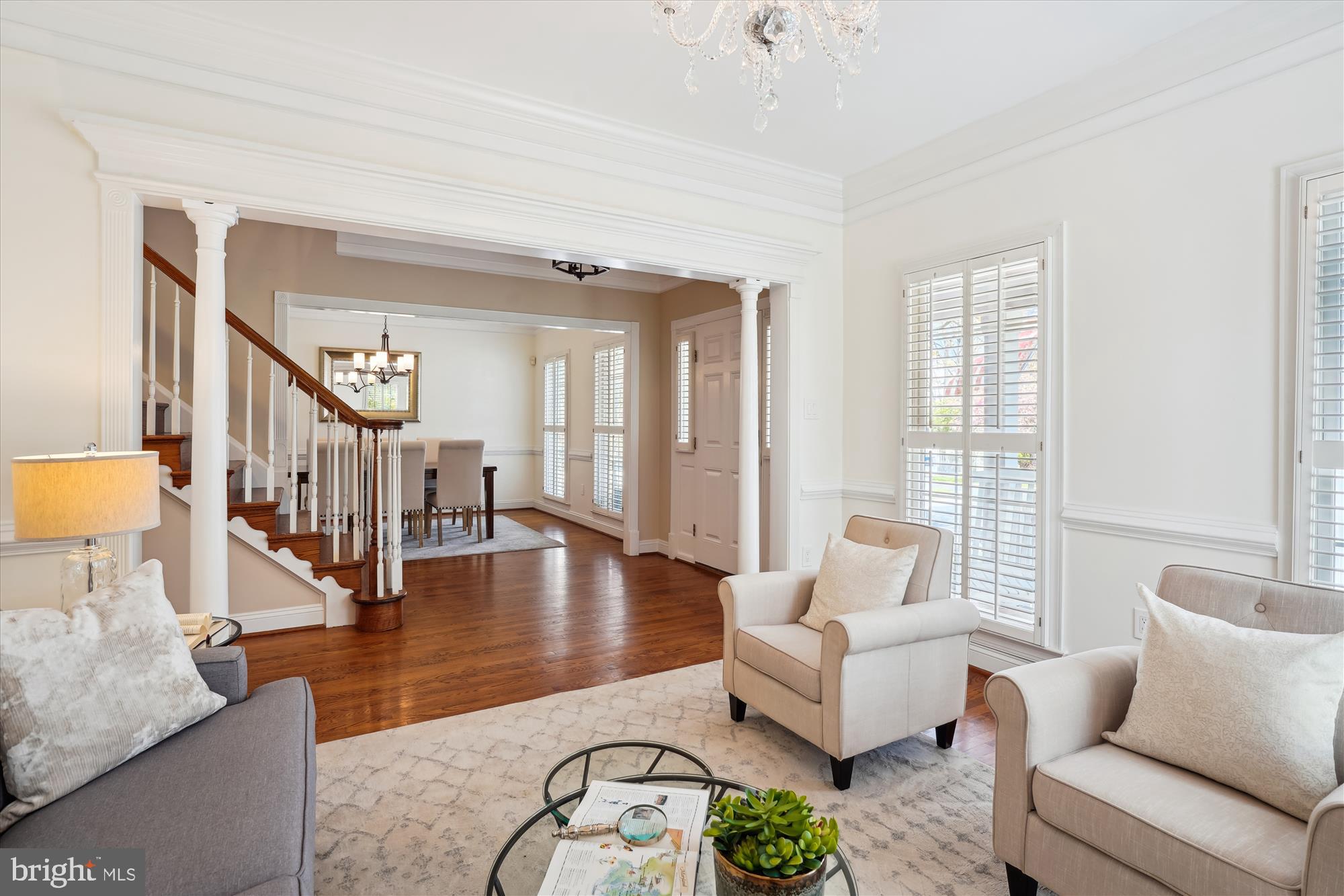 302 Tschiffely Square Road Gaithersburg, MD 20878 - Photo 7 of 77 a living room with furniture and a table with wooden floor