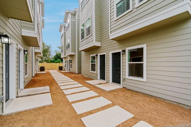 a view of a brick house with a large windows