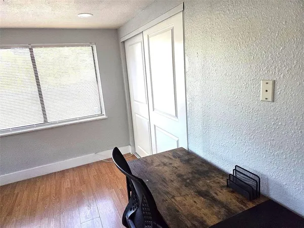 a workspace with furniture and window