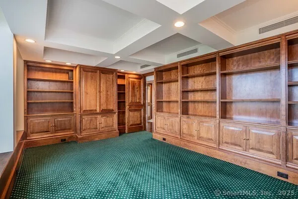 a view of an empty room with a fireplace