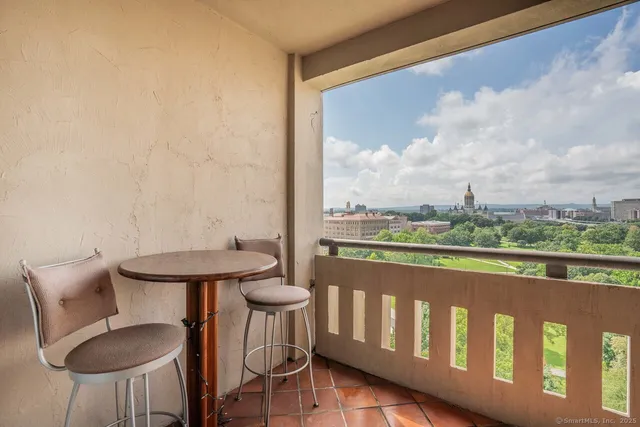 a view of a chairs and table in patio