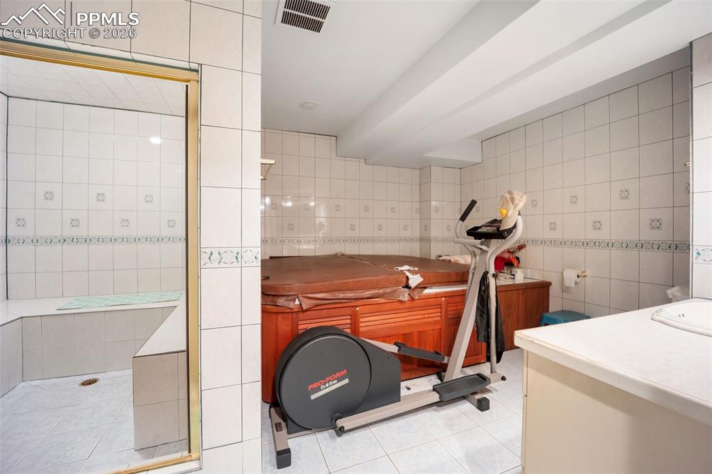 15 Mirada Road Colorado Springs, CO 80906 - Photo 37 of 50 Basement Sauna with Hot Tub and Steam Room