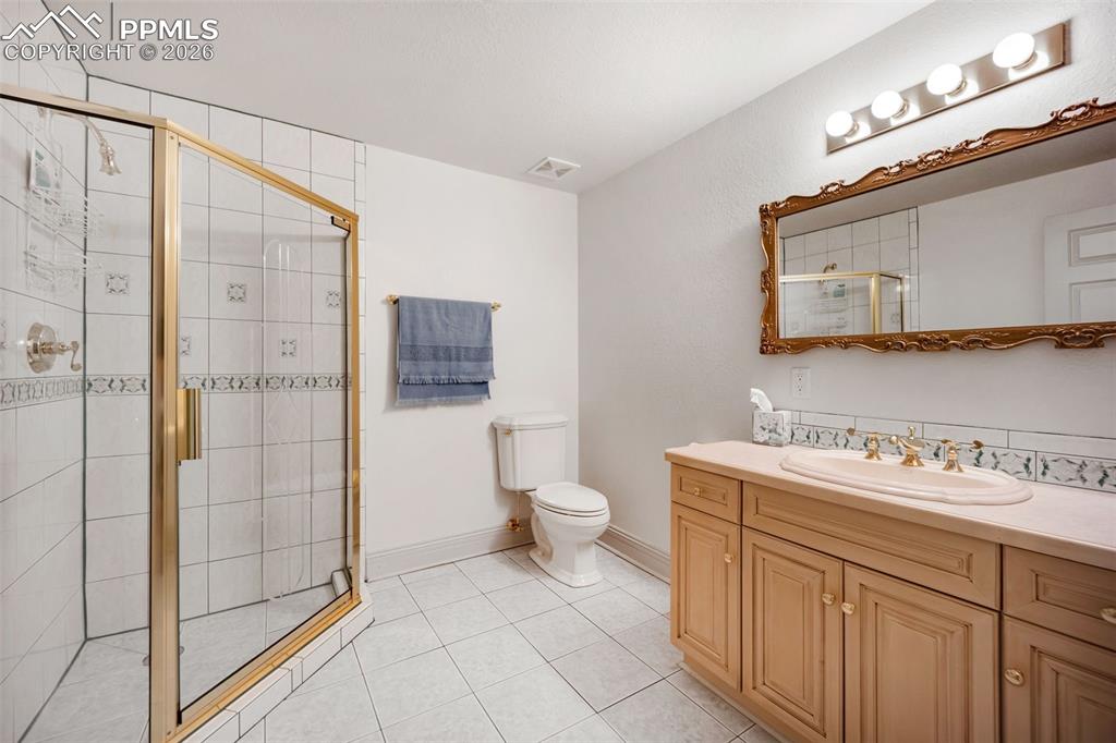 15 Mirada Road Colorado Springs, CO 80906 - Photo 39 of 50 a bathroom with a toilet sink and shower