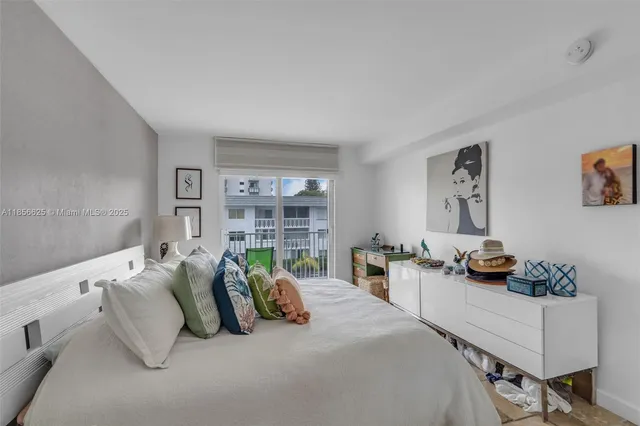 a bedroom with furniture and a potted plant