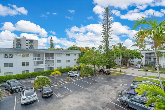 a view of a swimming pool in a backyard
