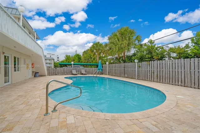 a view of a swimming pool with a terrace