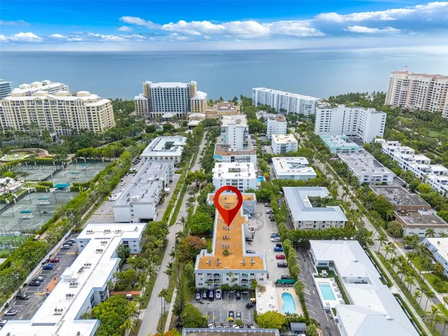 an aerial view of residential building and lake