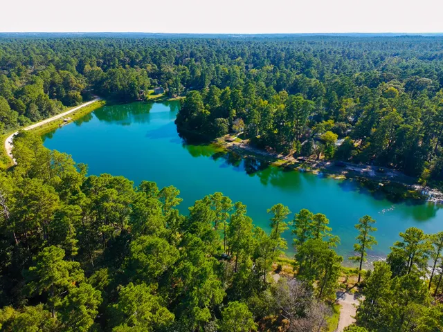 a view of a lake with a yard