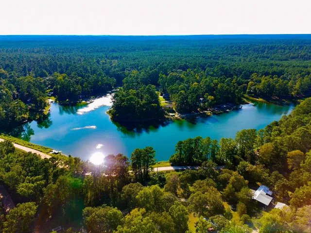 a view of a lake with a yard