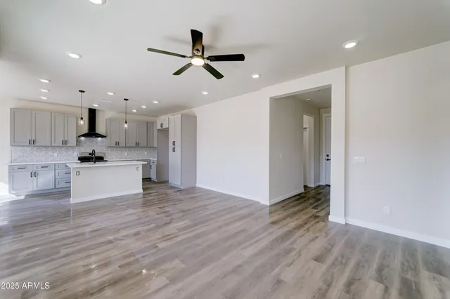 a view of kitchen with cabinets and wooden floor