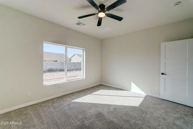 a view of an empty room and window