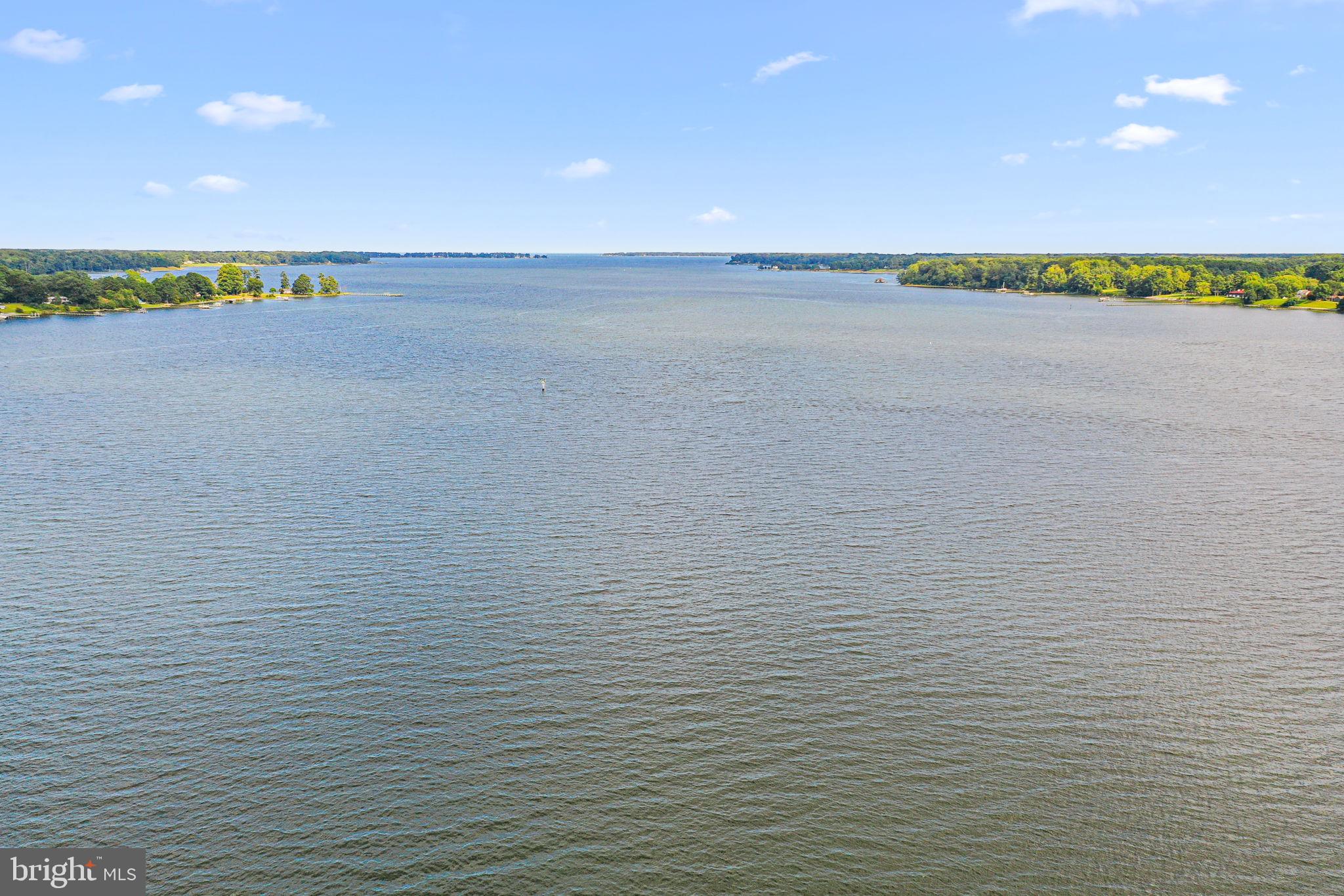 975 Wilton Creek Road Hartfield, VA 23071 - Photo 1 of 33 a view of an ocean and trees