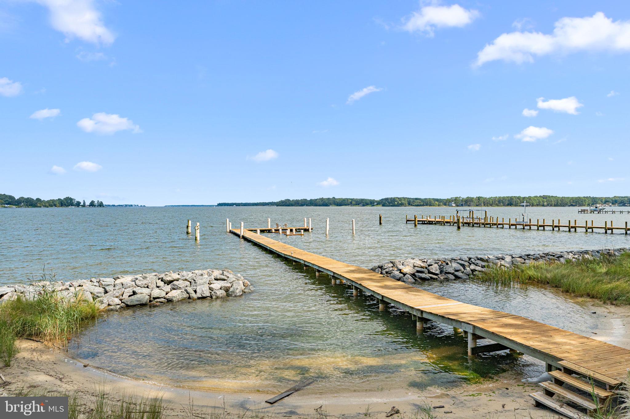 975 Wilton Creek Road Hartfield, VA 23071 - Photo 4 of 33 a view of a lake with a city
