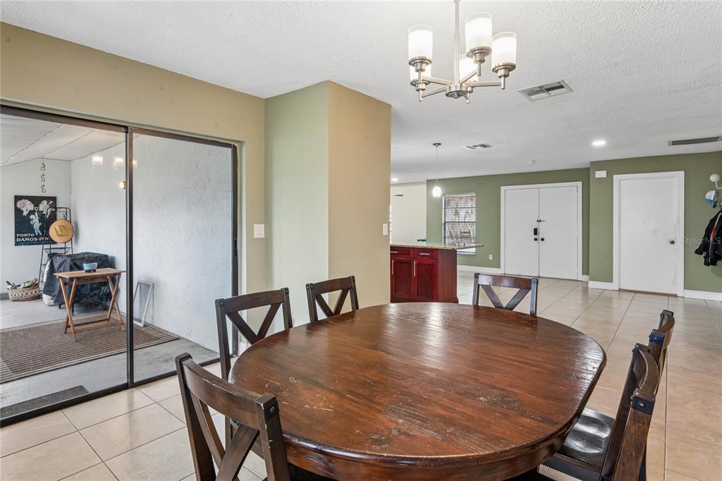 3112 Polk Avenue Spring Hill, FL 34609 - Photo 14 of 50 a dining room with furniture and window