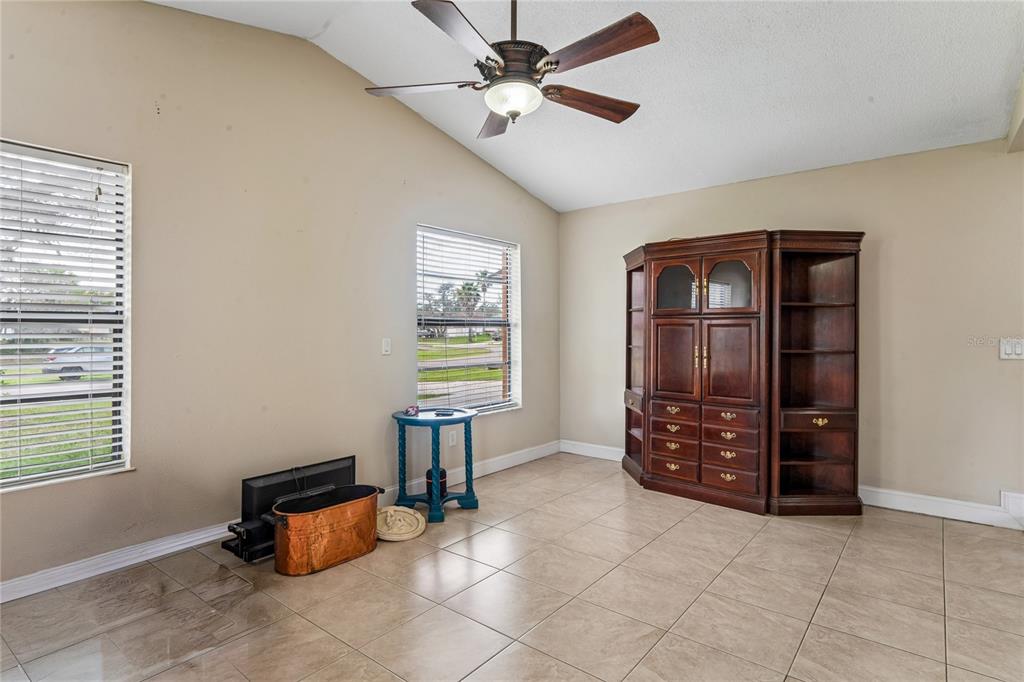3112 Polk Avenue Spring Hill, FL 34609 - Photo 17 of 50 a view of workspace with window and a chandelier fan