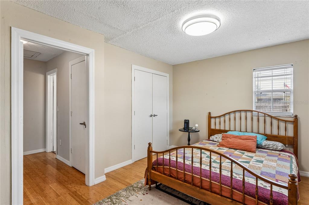 3112 Polk Avenue Spring Hill, FL 34609 - Photo 25 of 50 a bedroom with a bed and a window