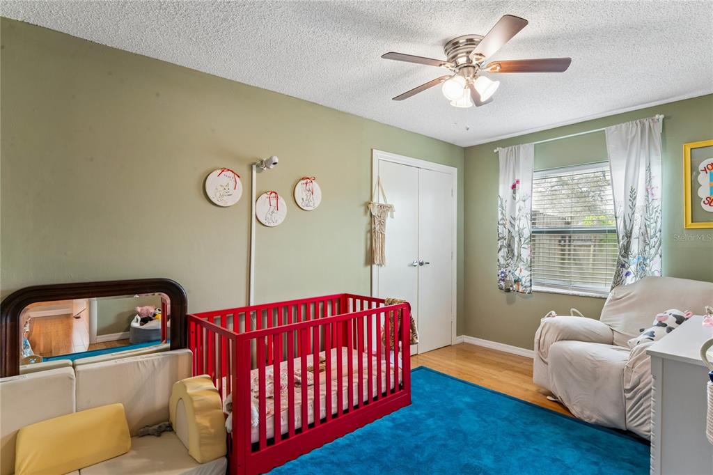 3112 Polk Avenue Spring Hill, FL 34609 - Photo 29 of 50 a bedroom with a bed and window