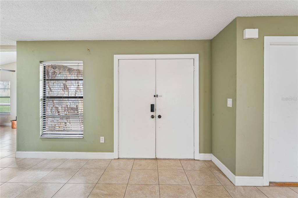 3112 Polk Avenue Spring Hill, FL 34609 - Photo 3 of 50 a view of an empty room with window