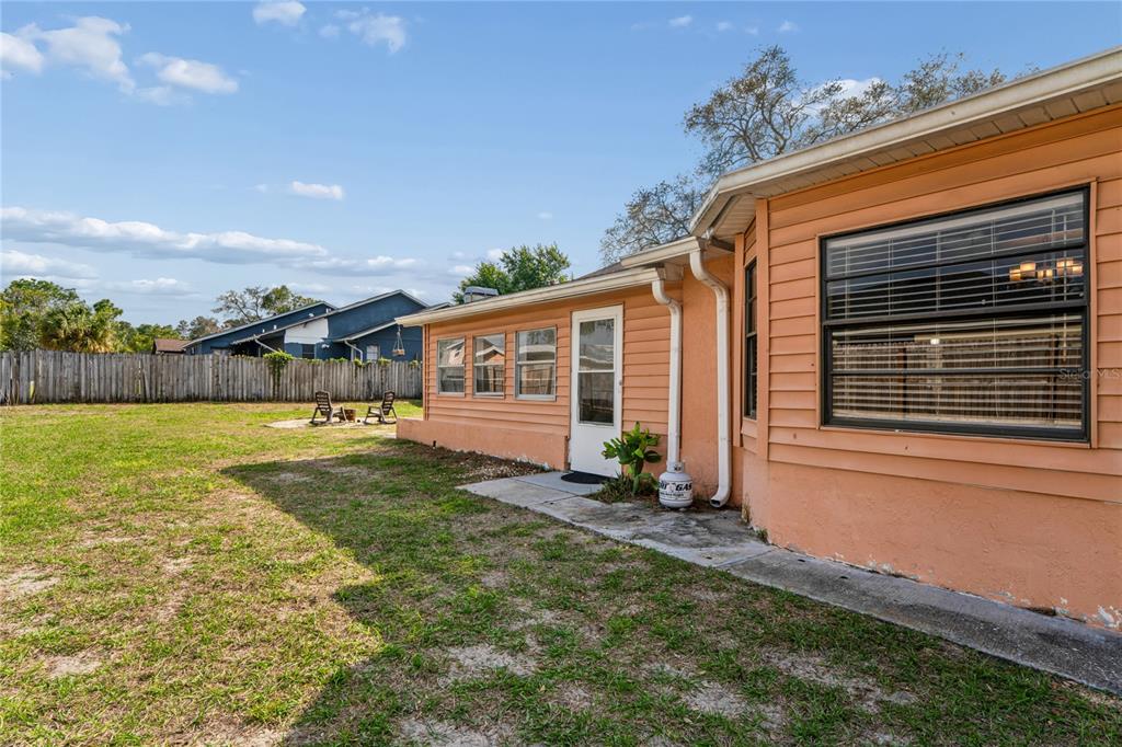 3112 Polk Avenue Spring Hill, FL 34609 - Photo 34 of 50 a front view of a house with garden
