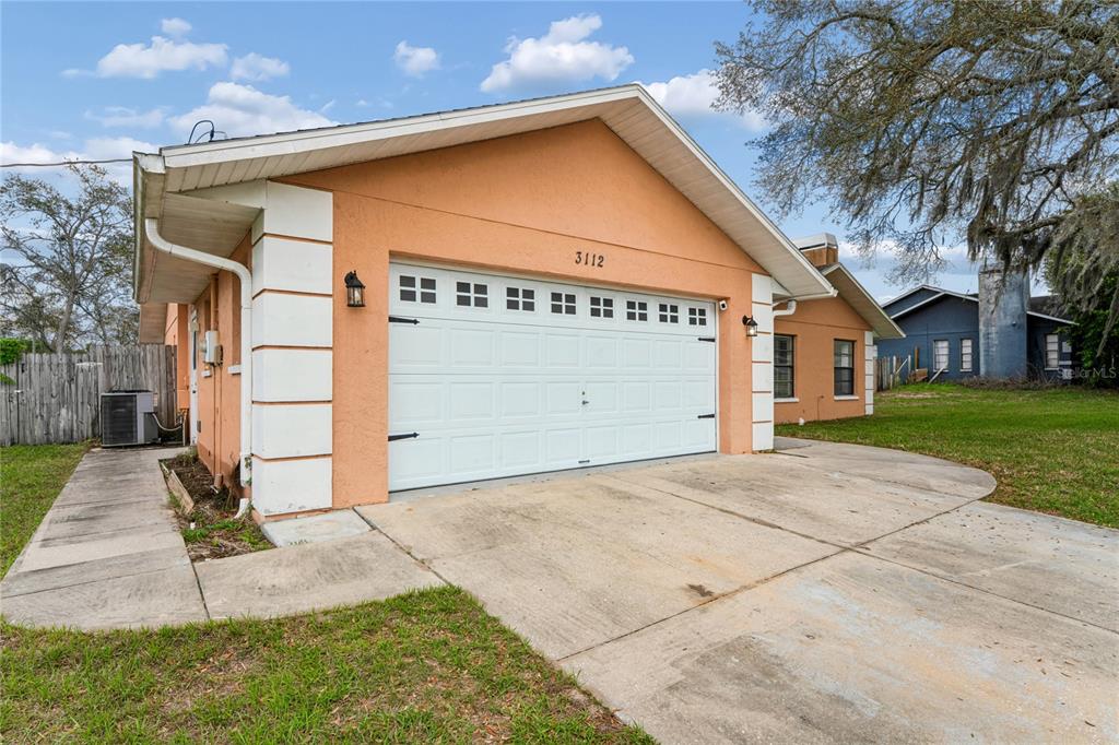 3112 Polk Avenue Spring Hill, FL 34609 - Photo 39 of 50 a view of a house with a yard
