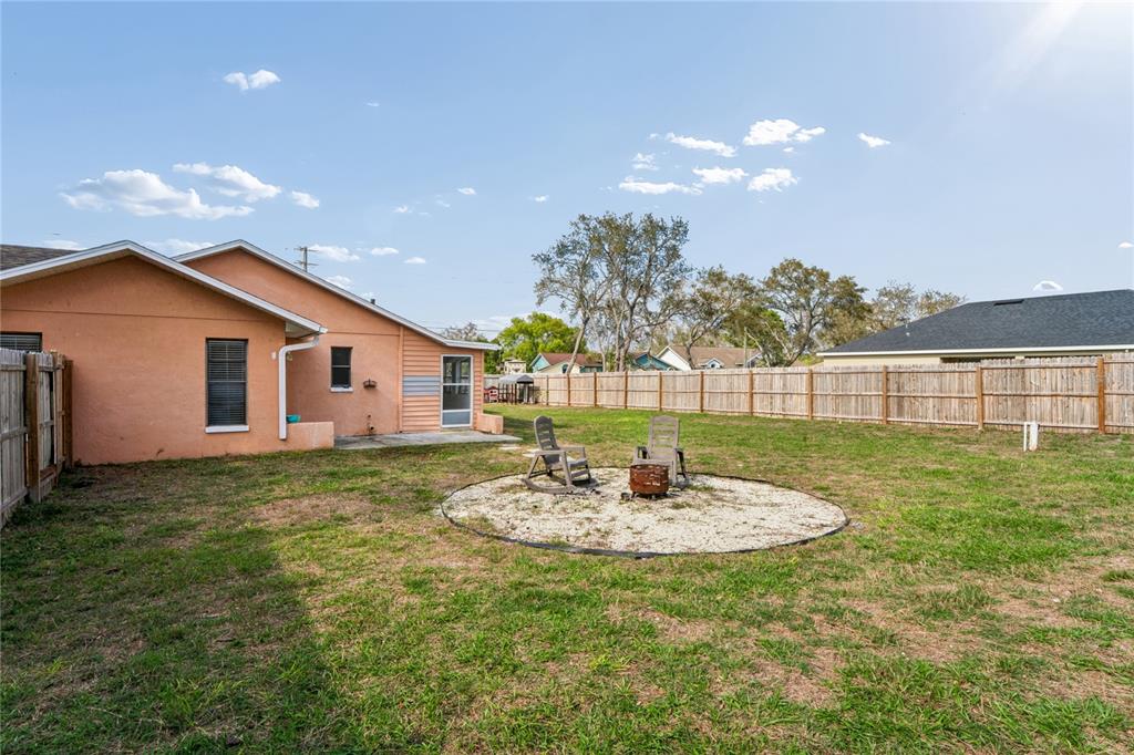 3112 Polk Avenue Spring Hill, FL 34609 - Photo 43 of 50 a swimming pool with outdoor seating and garden