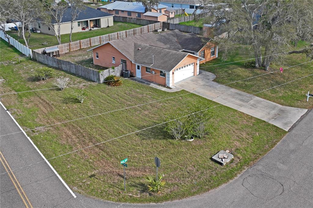 3112 Polk Avenue Spring Hill, FL 34609 - Photo 46 of 50 a view of a house with a yard