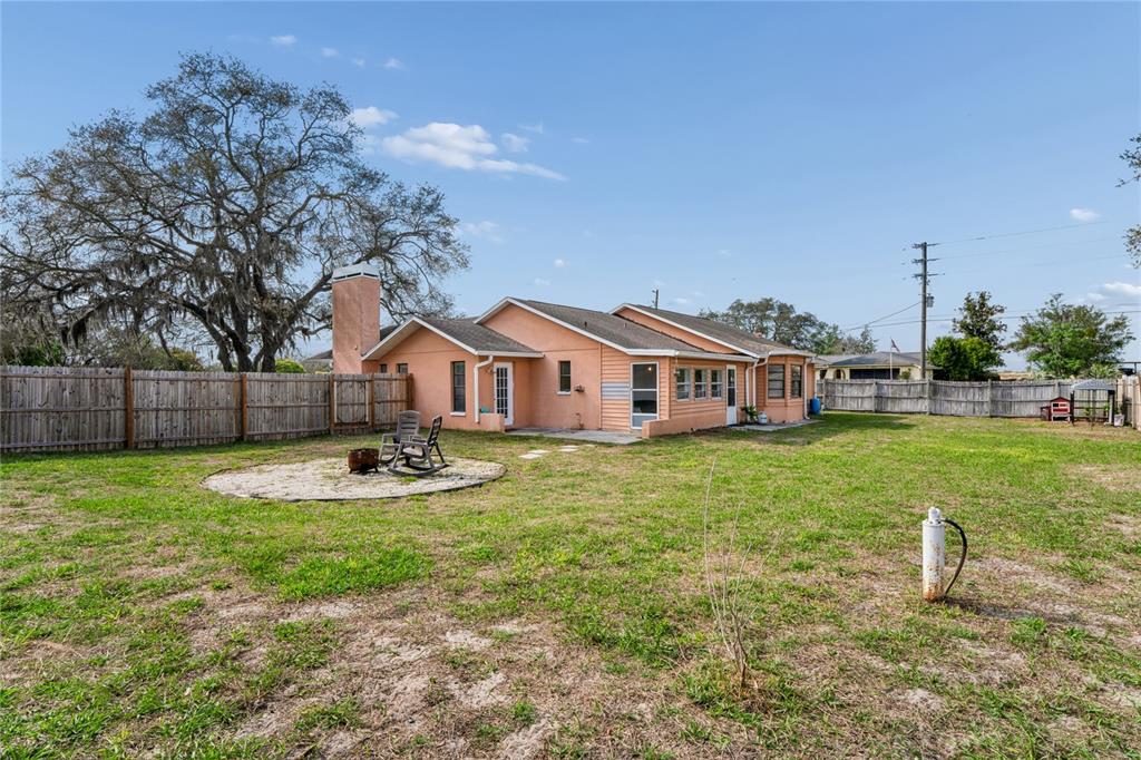 3112 Polk Avenue Spring Hill, FL 34609 - Photo 47 of 50 a view of a house with backyard and sitting area