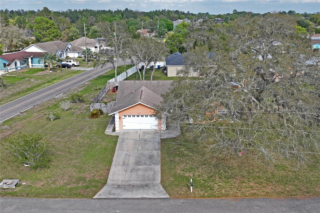 3112 Polk Avenue Spring Hill, FL 34609 - Photo 49 of 50 a sign board with buildings in the background