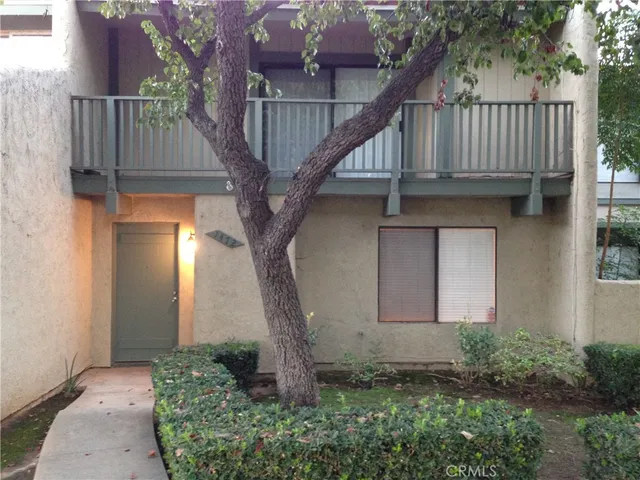 a house with trees in front of it