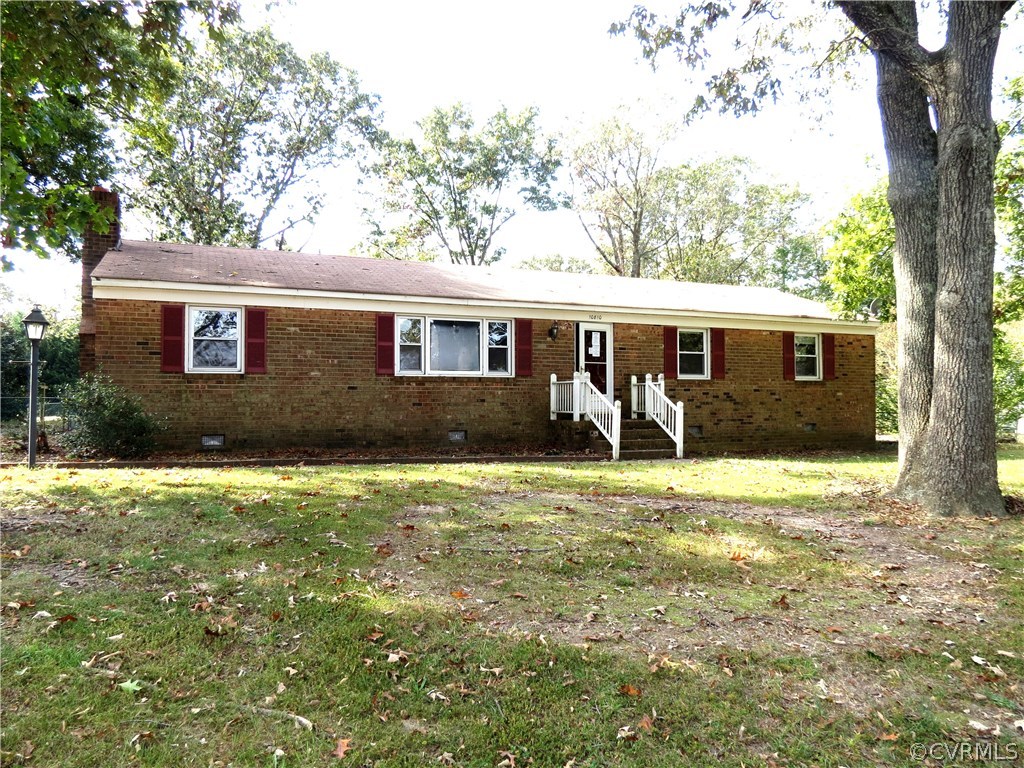 10810 Surry Road Chester, VA 23831 - Photo 1 of 24 a view of a house with backyard and a tree