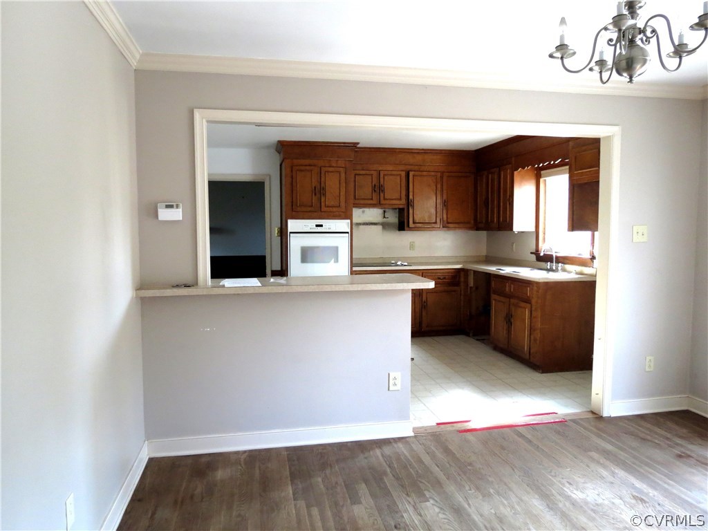 10810 Surry Road Chester, VA 23831 - Photo 12 of 24 a kitchen with a sink cabinets and window