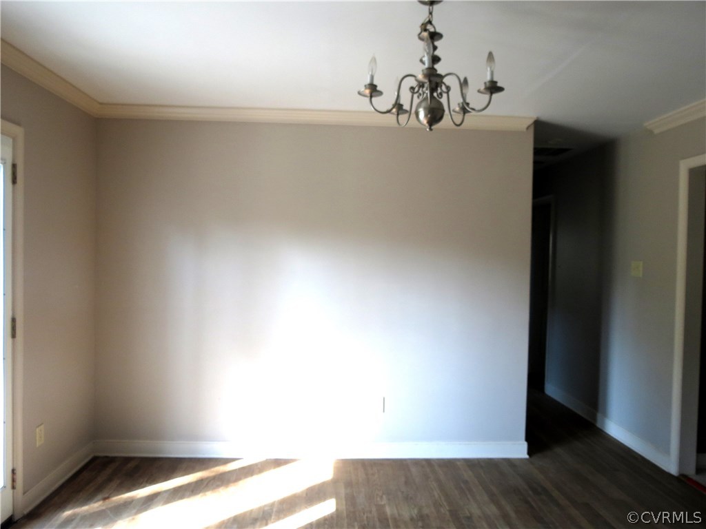 10810 Surry Road Chester, VA 23831 - Photo 13 of 24 an empty room with wooden floor and windows