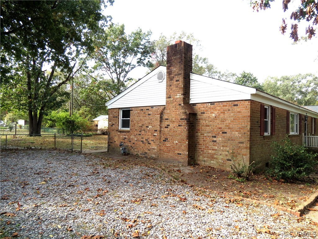 10810 Surry Road Chester, VA 23831 - Photo 2 of 24 a view of a house with a backyard