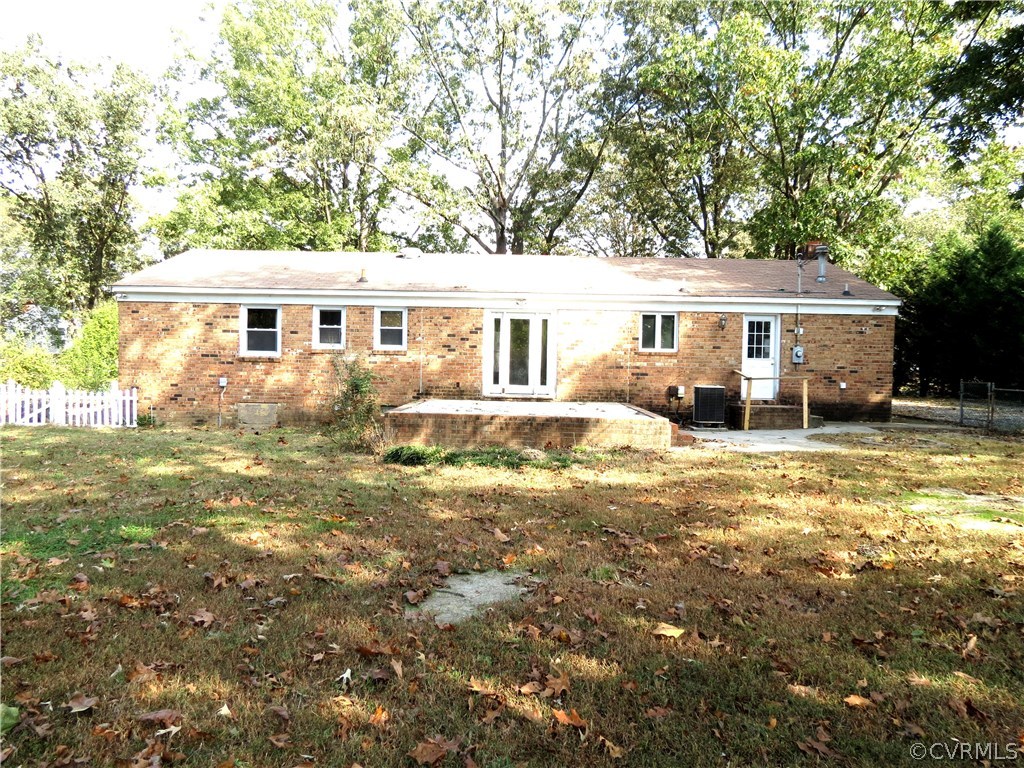10810 Surry Road Chester, VA 23831 - Photo 22 of 24 a view of a house with a yard