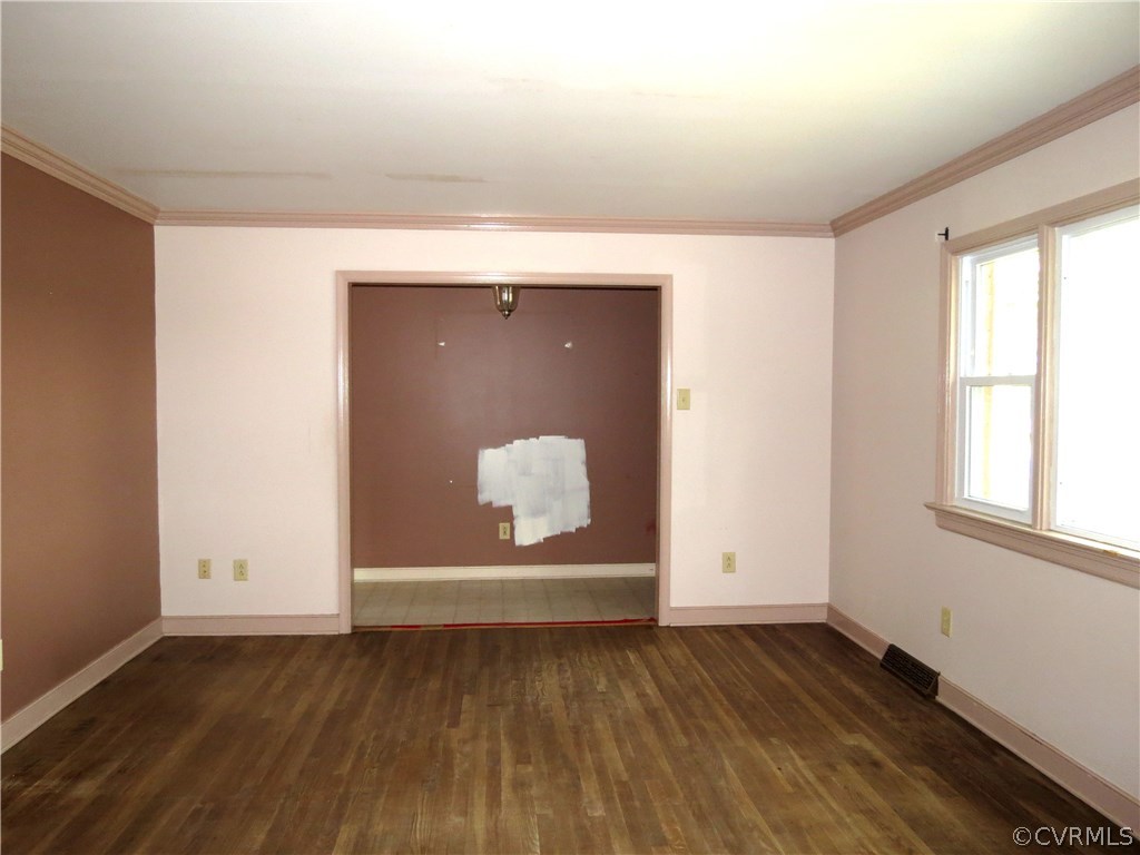 10810 Surry Road Chester, VA 23831 - Photo 6 of 24 an empty room with wooden floor and windows
