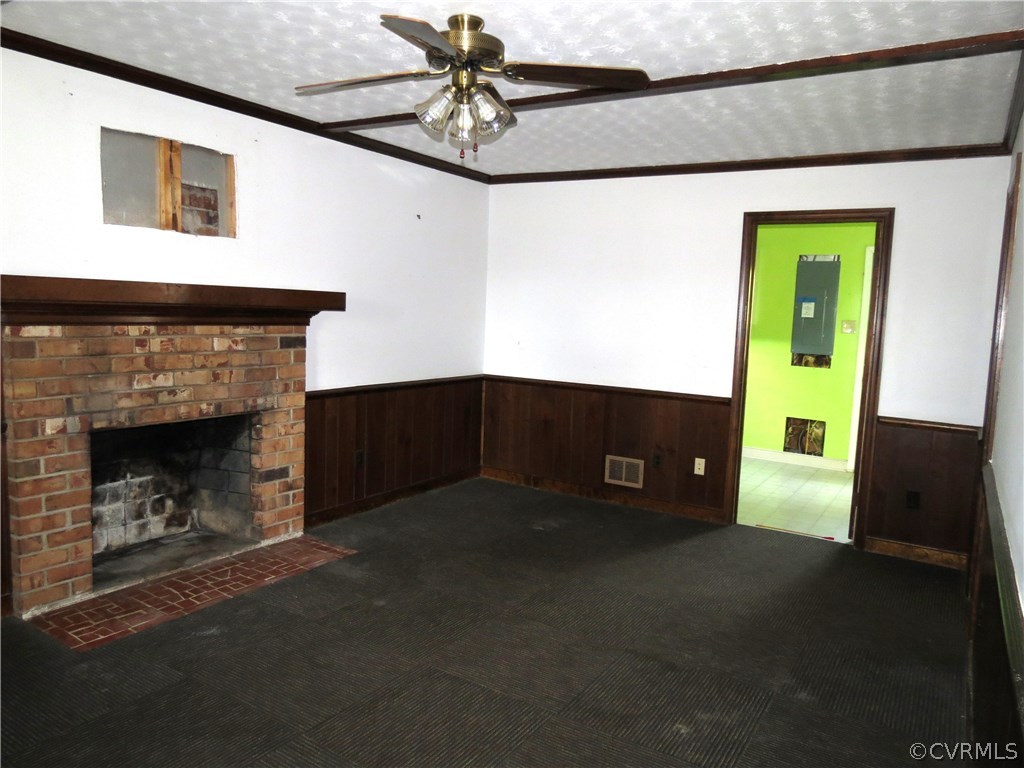 10810 Surry Road Chester, VA 23831 - Photo 9 of 24 a kitchen with furniture and a fireplace