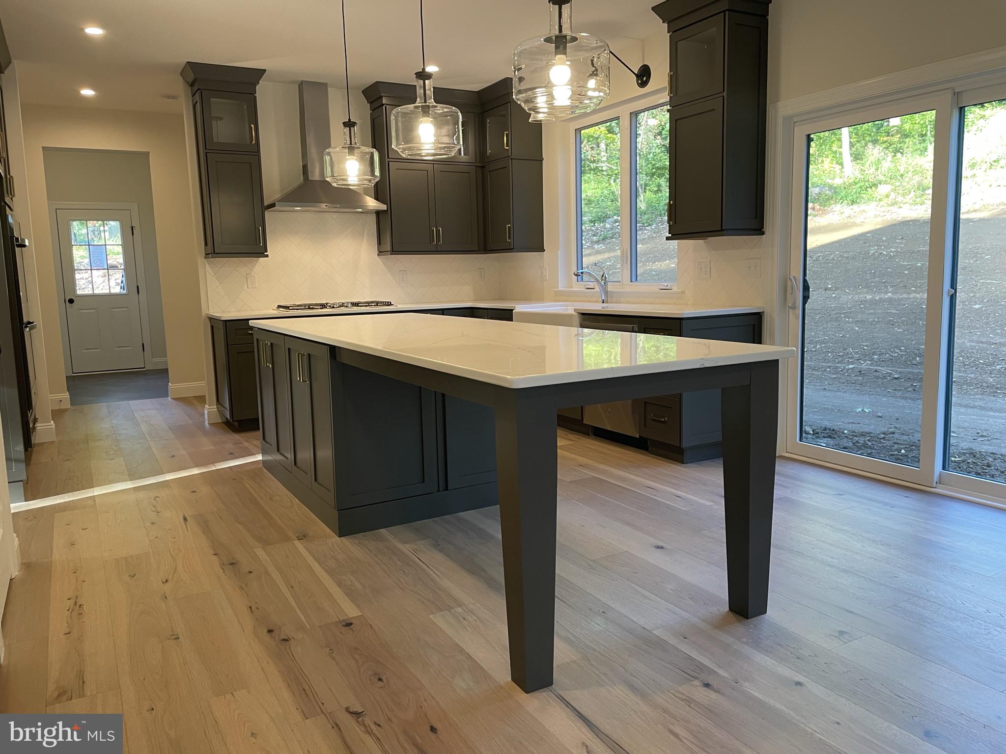 723 A Saylors Mill Road Spring City, PA 19475 - Photo 18 of 25 a view of kitchen island dining room wooden floor and living room